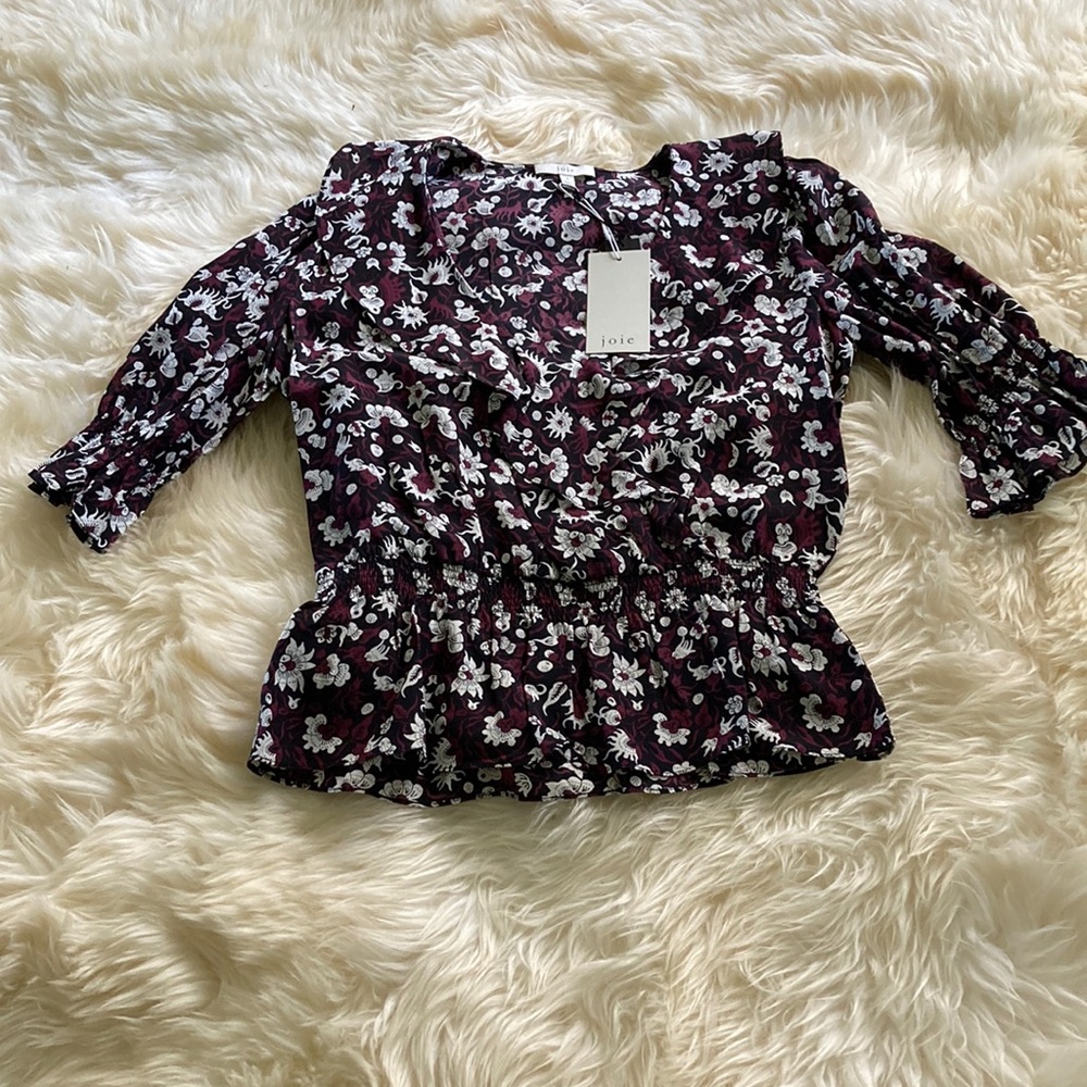 Joie three-quarter sleeve blouse with ruffle detail at the neck.